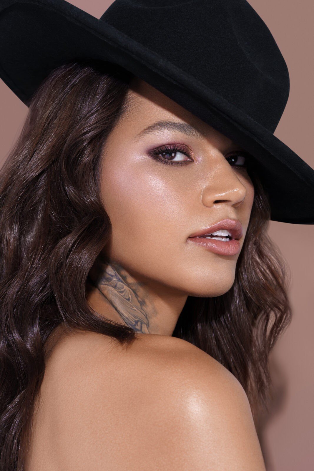 image of a model wearing a black hat